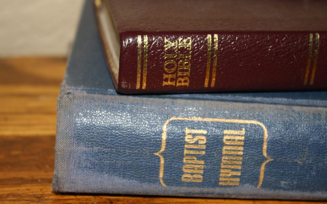 A Bible sitting on top of a Baptist hymnal