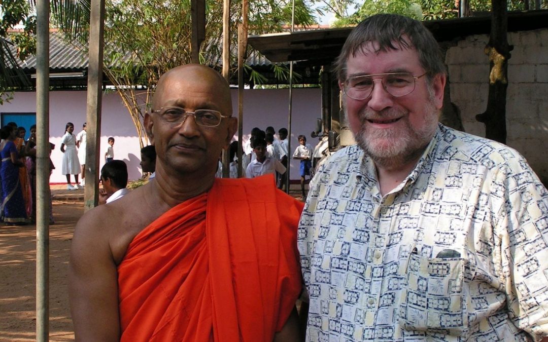 Paul Montecute with a Buddhist leader