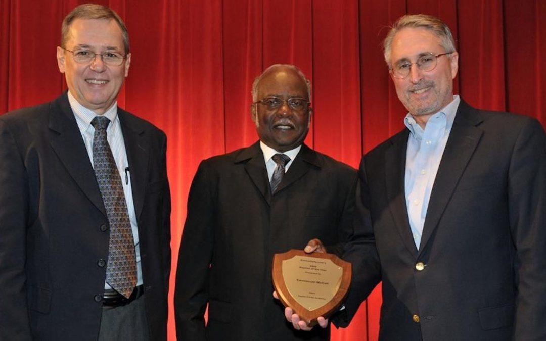 Daniel Carro and Robert Parham presenting Emmanuel McCall an award