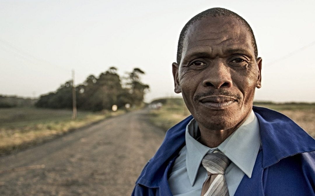 Middle-aged African American male standing outside