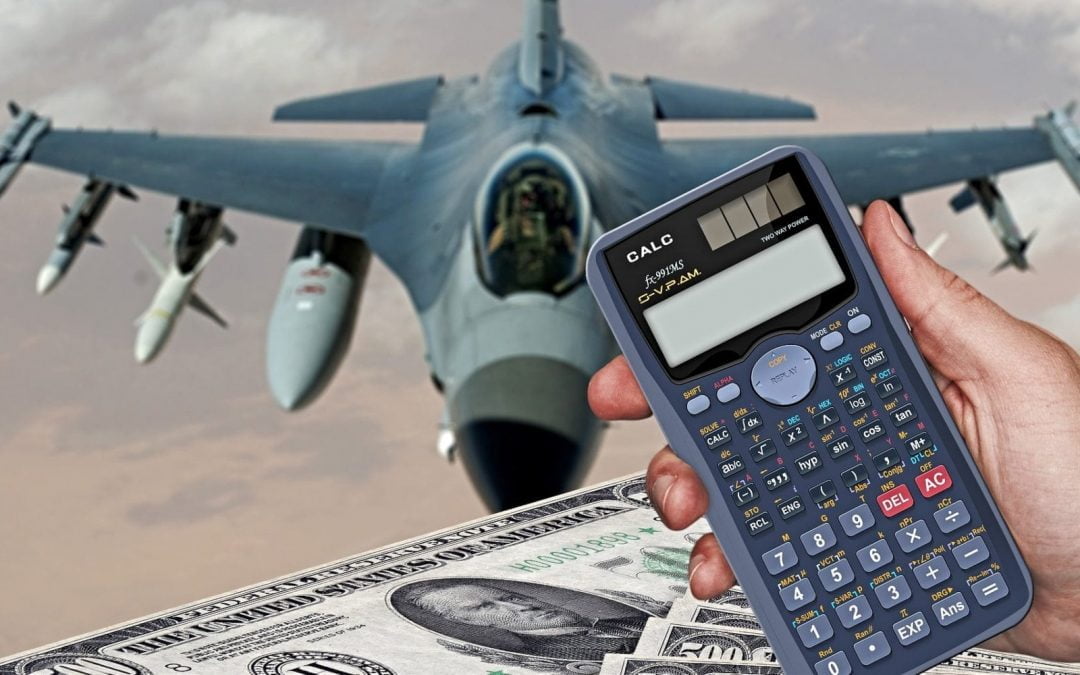 Calculator and $500 bills in front of military jet