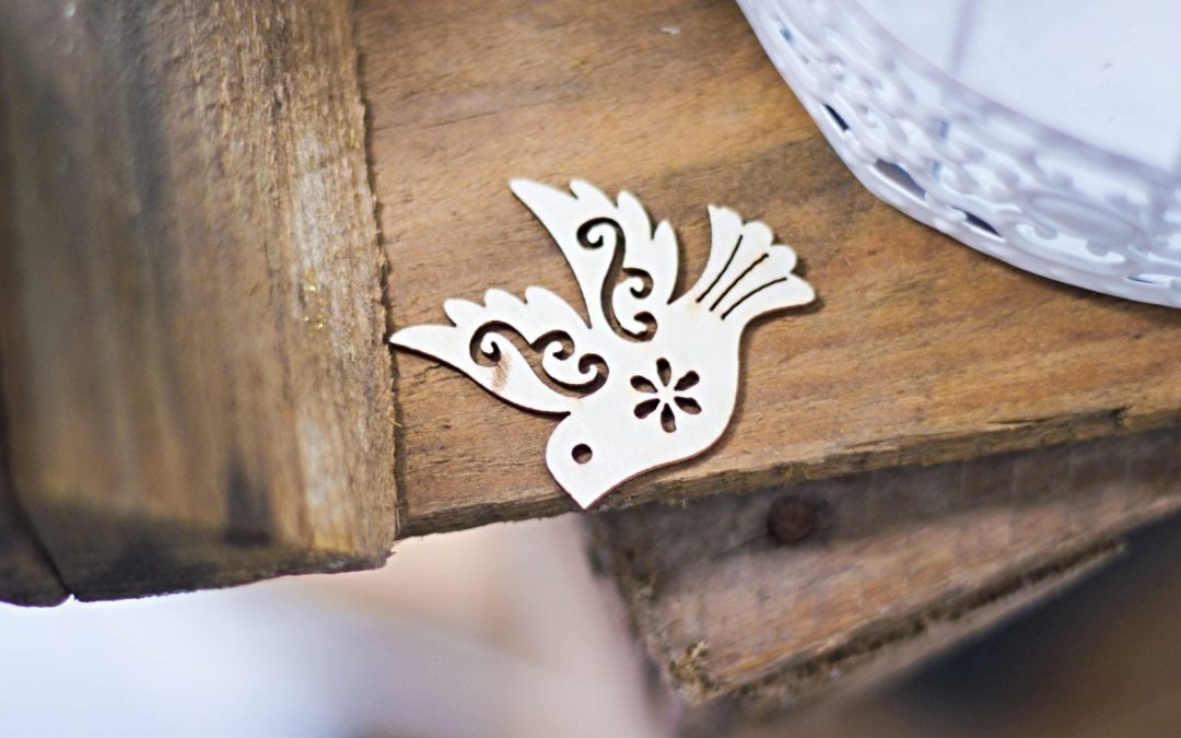 Ornamental dove at edge of table